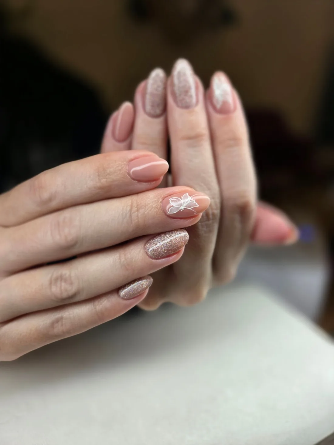 Nude and glitter gel manicure